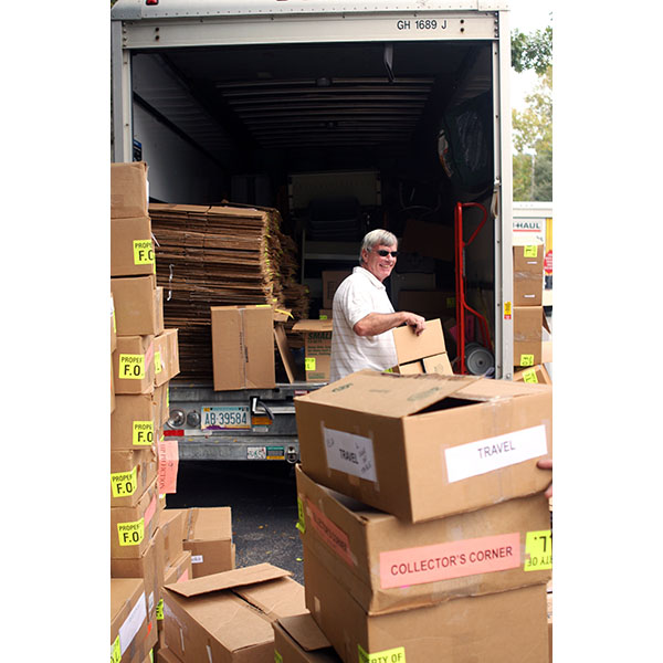 volunteer loading boxes on truck